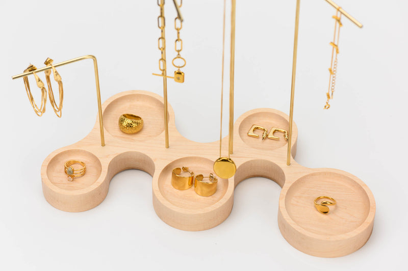 Close-up image for W shape ultra modern maple based brass bar jewelry organizer